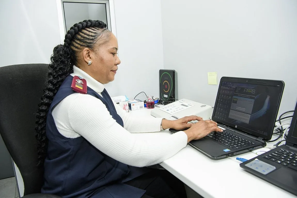 An occupational health nurse capturing results at the reporting terminal